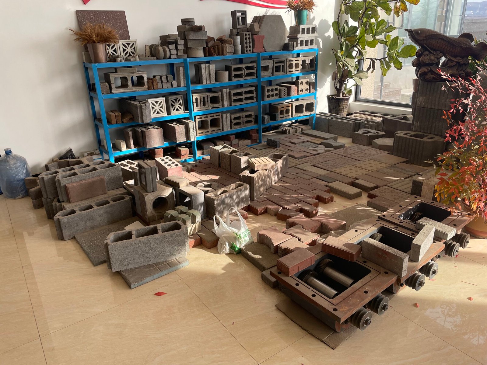 Original photograph of a concrete block sample display with moulds in the foreground