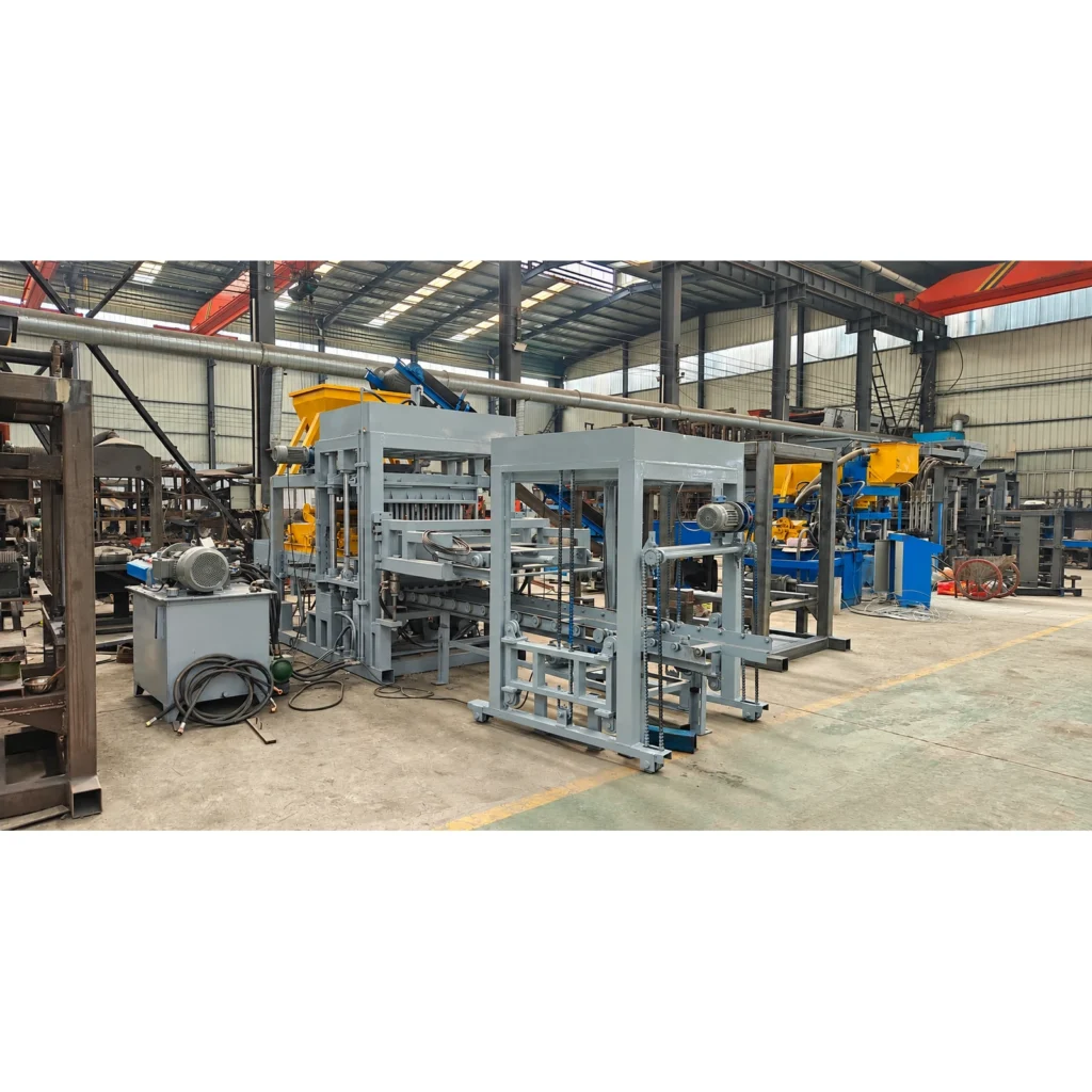 QT4-15 block making machine with hydraulic unit and front handling frame in a workshop.