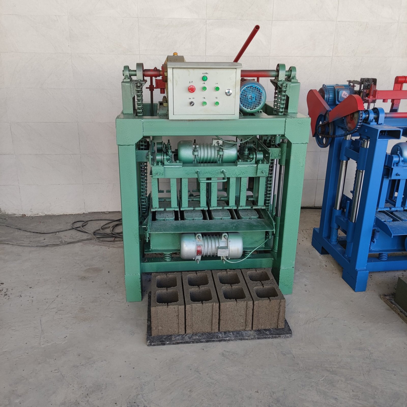 VS-4-35B block making machine with four hollow concrete block samples